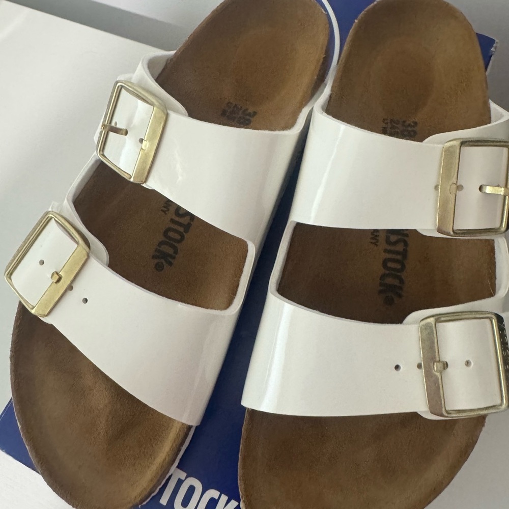 Birkenstock White Sandals with Metallic Buckles